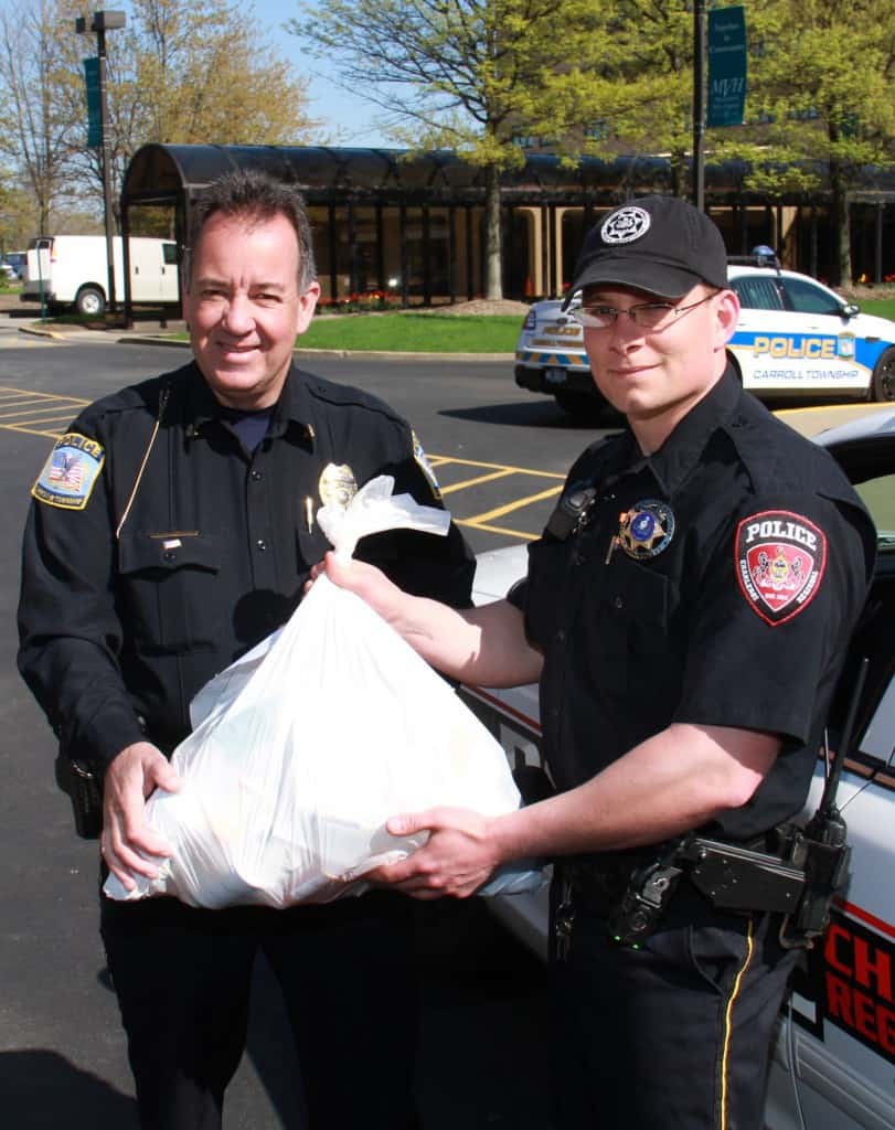 Monongahela Valley Hospital Offers Easy Disposal for Unused Drugs Oct. 26 1 Carroll Twp. Police Chief Paul Brand and Officer Ryan Brand of Charleroi display one of the bags of drugs donated to the 6th National Drug Take Back Day in April.